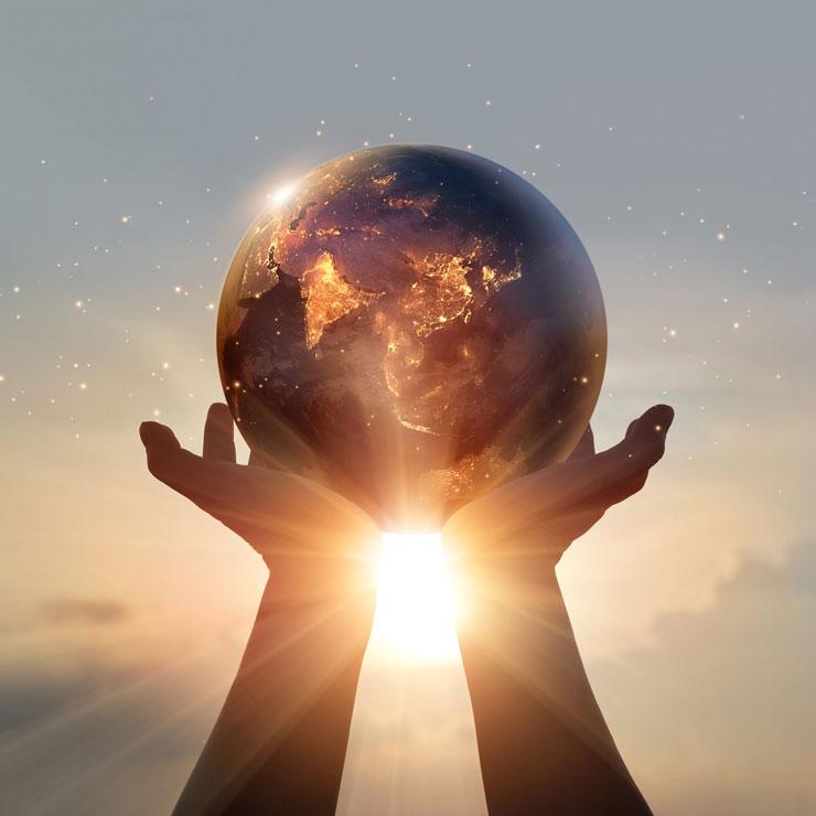 Hands holding a globe